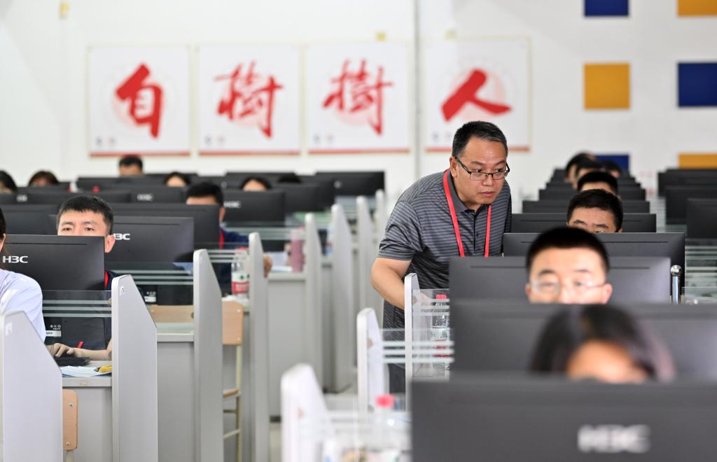 Teachers grading high school entrance exam papers at Tianjin Normal University. Photo: Xinhua