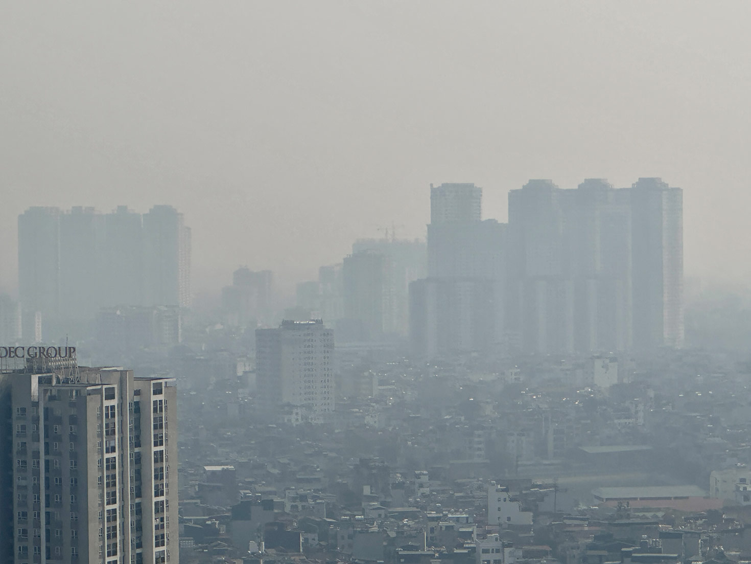 Buildings in Hanoi City are obscured by air pollution. Photo: Viet Anh