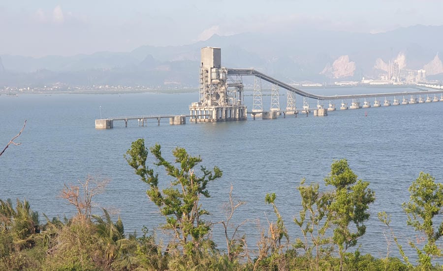 Hon Gac Island is not far from the conveyor belt system of a cement factory. Photo: Nguyen Hung