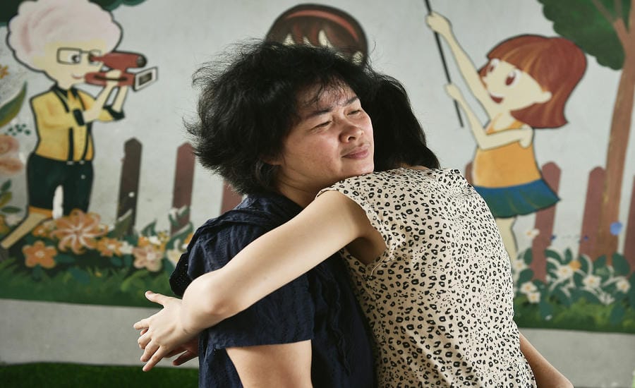 In her mother's arms (Ms. Le Thuy Duong and nephew Nguyen Le Yen Dan live in Ho Chi Minh City).