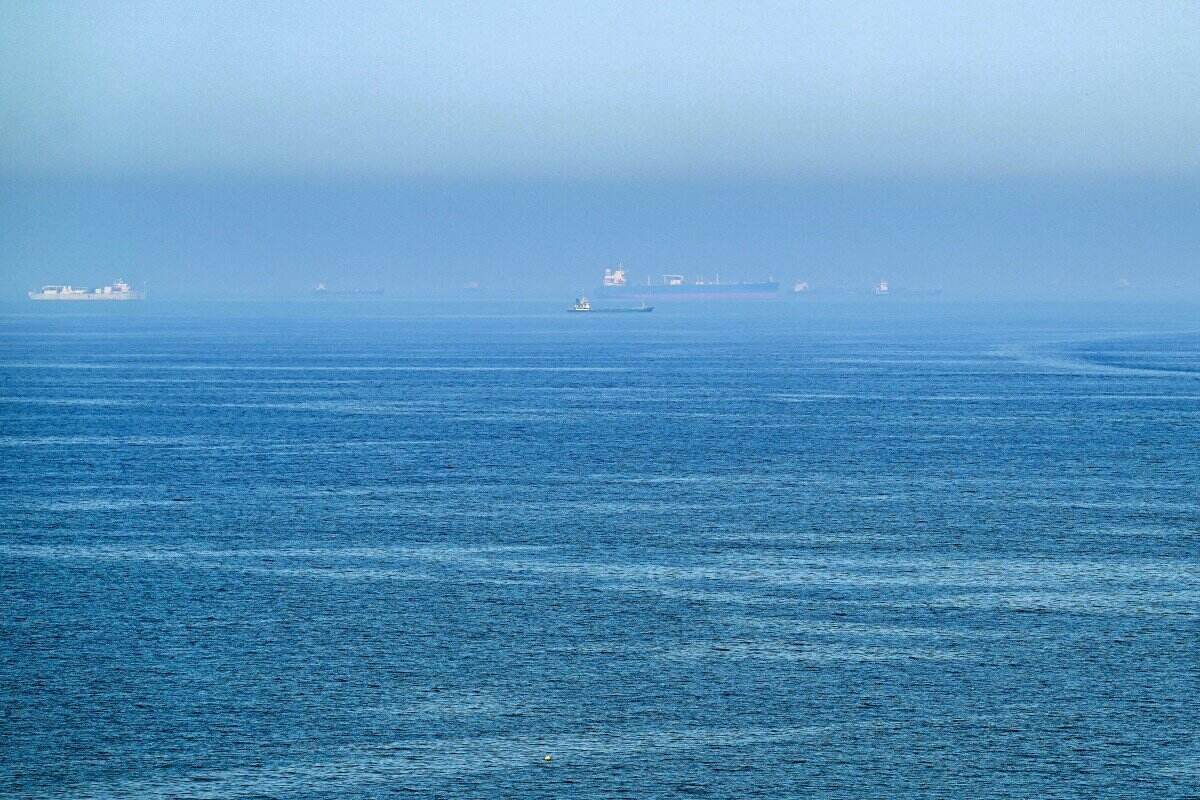 The US just airstriked Iran on June 26 after Iran attacked a commercial ship. Pictured are cargo ships off the coast of Khor Fakkan container port along the Gulf of Oman. Photo: AFP