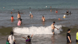 Tightening safety measures for tourists swimming in Thuan An beach during peak season. Photo: Hong Quan