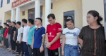 Dozens of subjects in a transnational gambling and money laundering ring caught. Photo: Ha Tinh Police