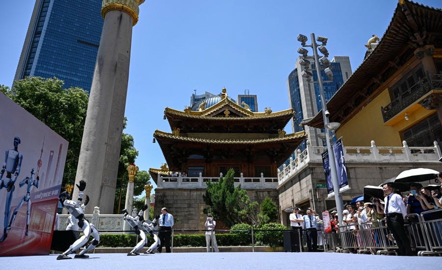 Tourists visit robots performing at Unitree Company in China. Photo: AFP