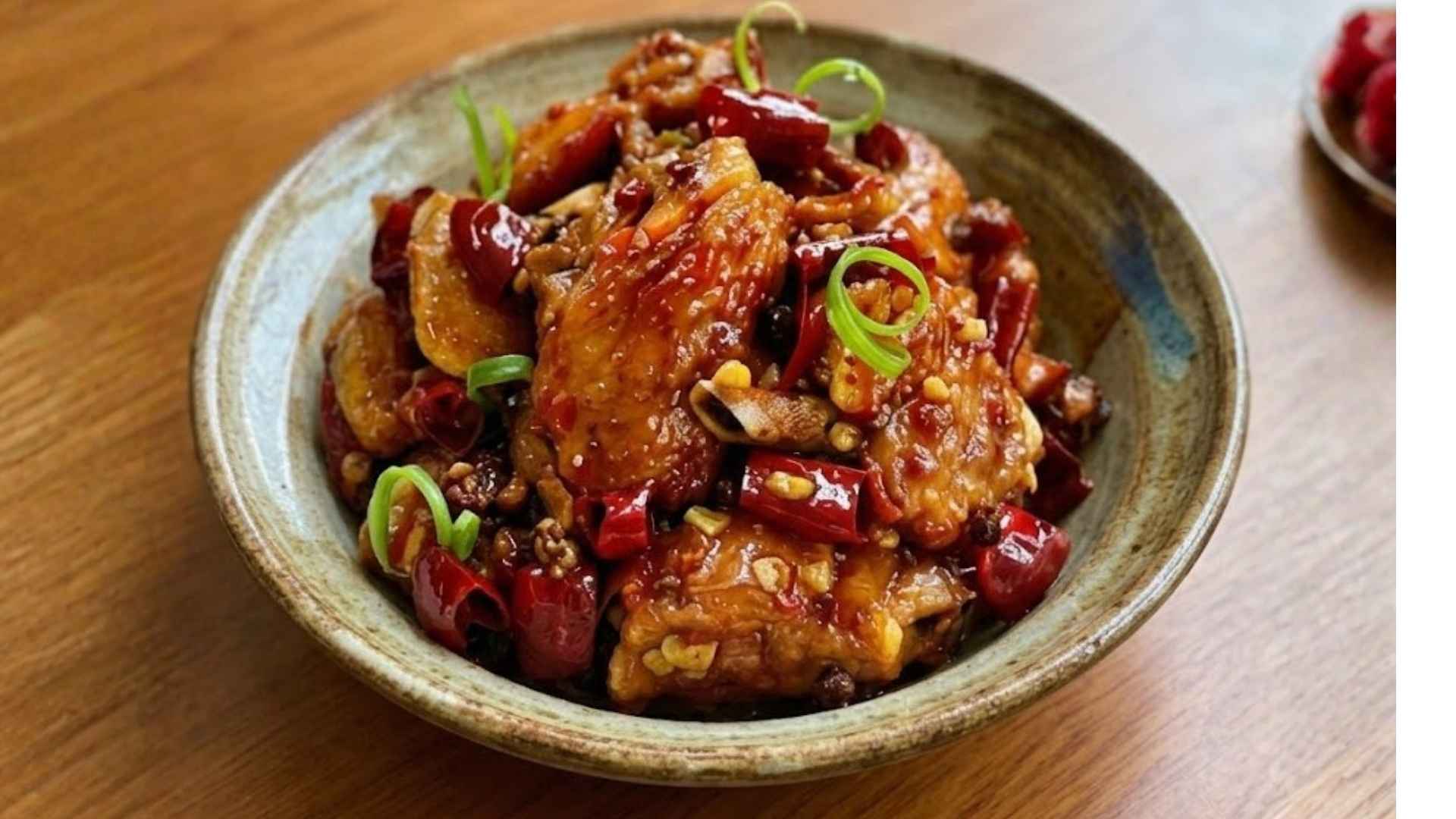 Spicy and sour chicken wings stand out with eye-catching colors and an irresistible rich flavor. Graphics: Minh Vu