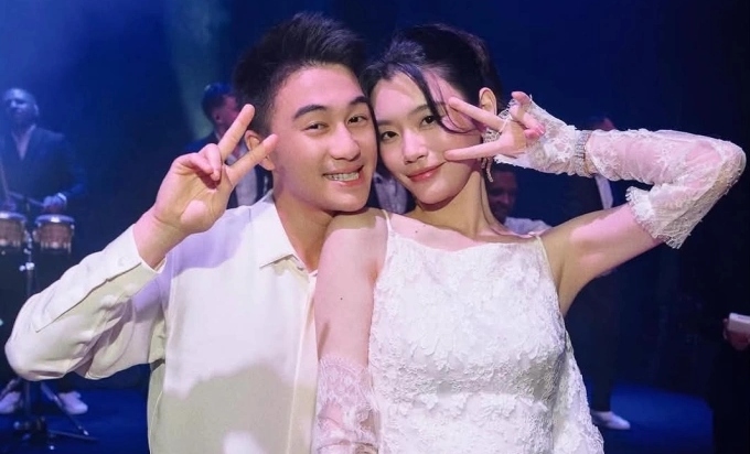 He Mengyao and her husband. Photo: Xinhua