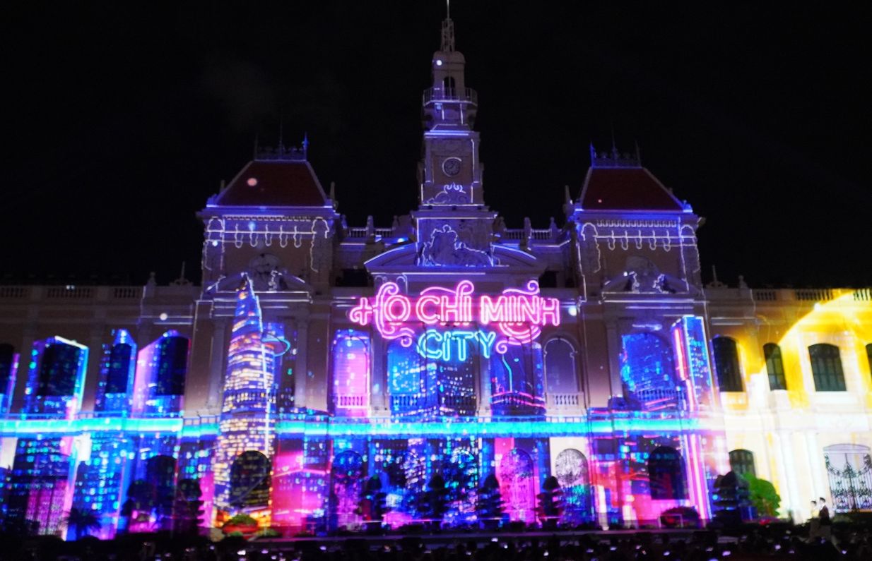 People flock to the center of Ho Chi Minh City to watch 3D mapping to celebrate the 50th anniversary of the city named after Uncle Ho