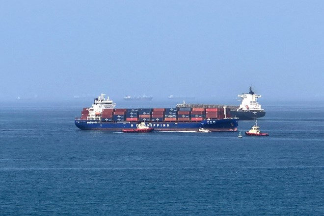 Cargo ships operating in Oman Bay. Photo: AFP