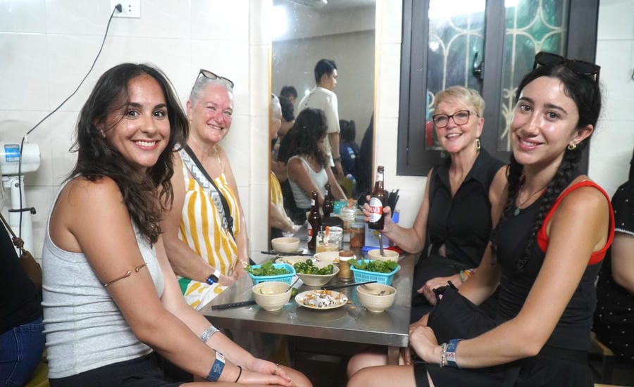 Western tourists enjoy banh cuon in Hanoi. Photo: Minh Chinh