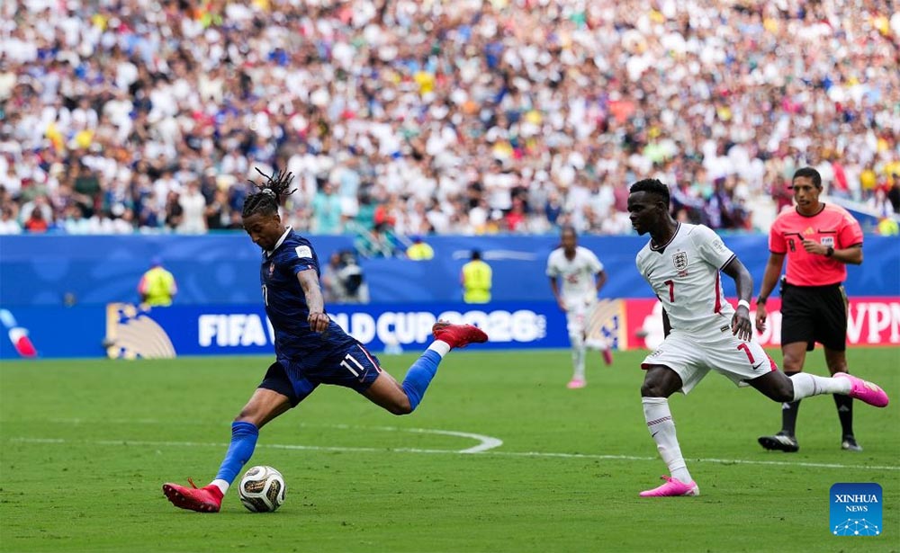Michael Olise (blue jersey) sets a record for the number of assists in a World Cup. Photo: Xinhua