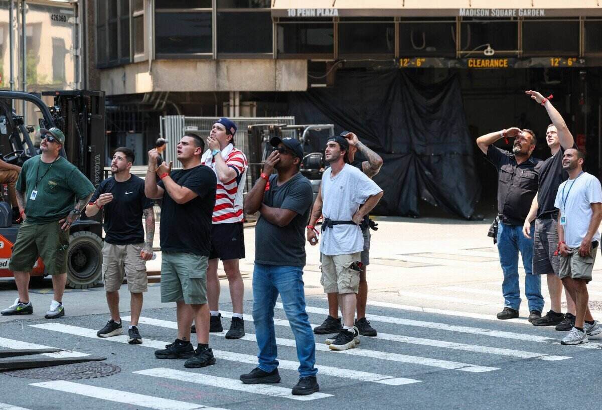 Public near Madison Square Garden looking towards the Empire State Building in New York as the couple climbed to the top of the building and proposed on July 1. Photo: AFP