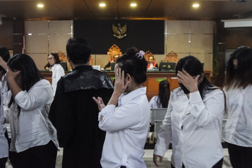 Defendants in the child trafficking case in Indonesia. Photo: AFP