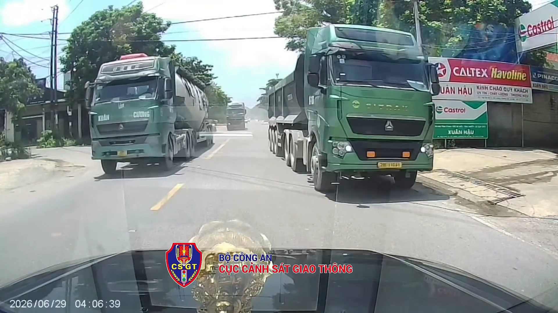 Trailer trucks go into the opposite lane to overtake. Photo cut from clip of the Traffic Police Department