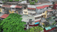 Close-up of many degraded apartment buildings and collectives in Hanoi waiting to be rebuilt