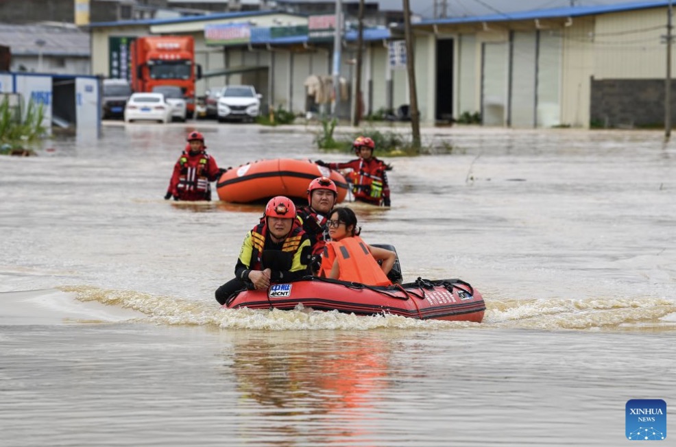 Rescue forces evacuate people trapped in Nanning city, China on July 6 amid floods. Photo: Xinhua