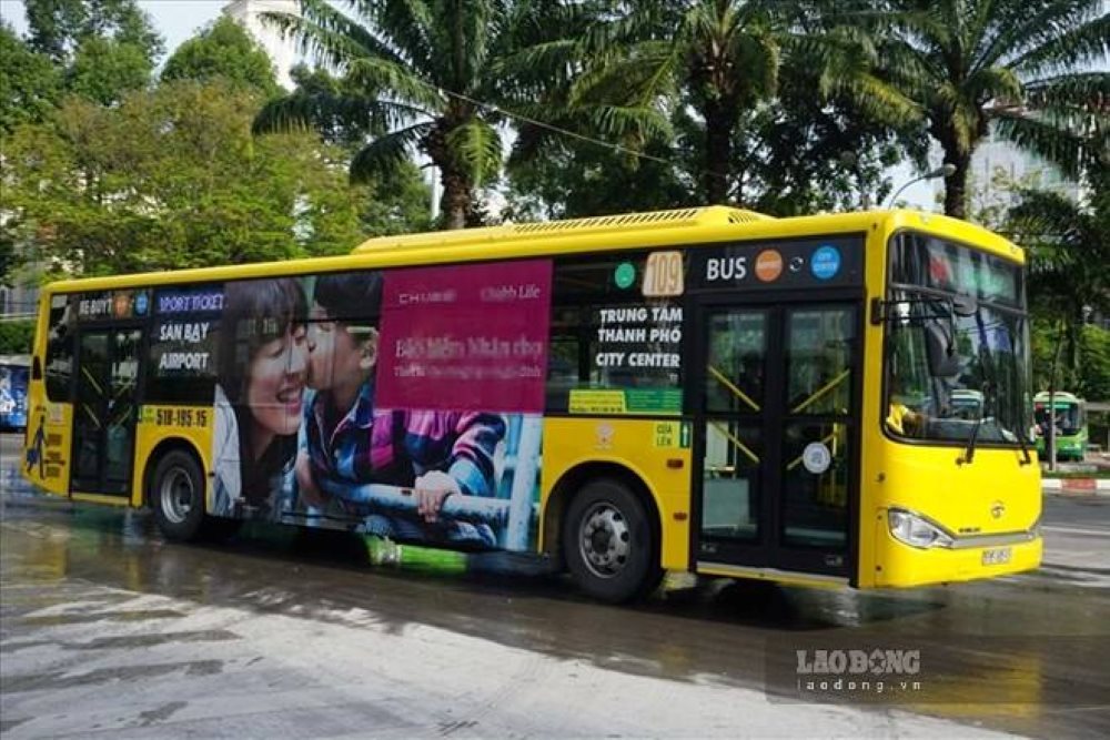 A bus in Ho Chi Minh City is plastered with advertisements on the body. Photo: Minh Quan
