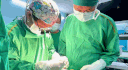 Doctors operate on a 1.3kg teratoma for a 5-day-old baby girl.
