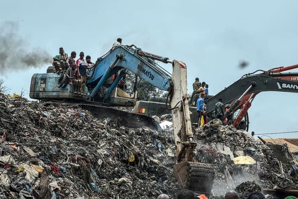 Rescue forces search for victims in the landslide landfill area in Conakry. Photo: AFP