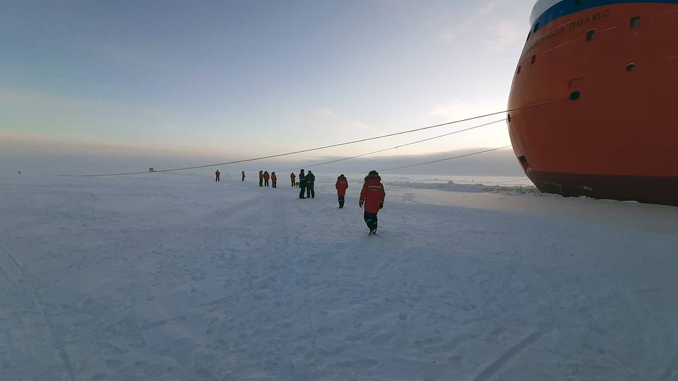 Researchers working on sea ice in the Arctic during a scientific expedition by Russia. Photo: TASS