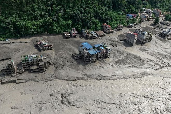 After the serious flash flood in the China-Nepal border area, Vietnamese leaders sent telegrams of condolences. Photo: AFP
