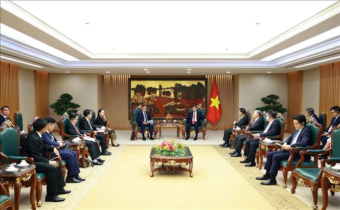 Thủ tướng Lê Minh Hưng tiếp Phó Thủ tướng, Bộ trưởng Tài chính Lào Santiphab Phomvihane. Ảnh: Dương Giang/TTXVN