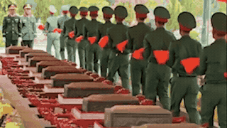 Bringing 13 sets of remains of martyrs in Cau Nhi to rest with their comrades. Photo: Hung Tho