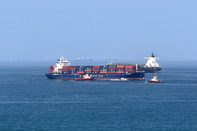Cargo ships operating in Oman Bay. Photo: AFP