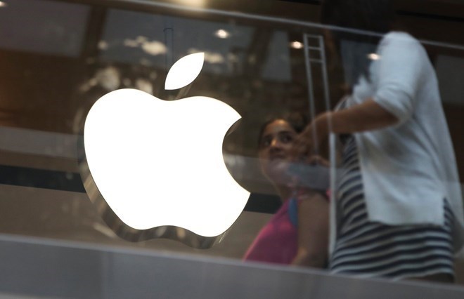 Apple's entry with the first folding iPhone promises to bring positive impacts to the market. Photo: Xinhua