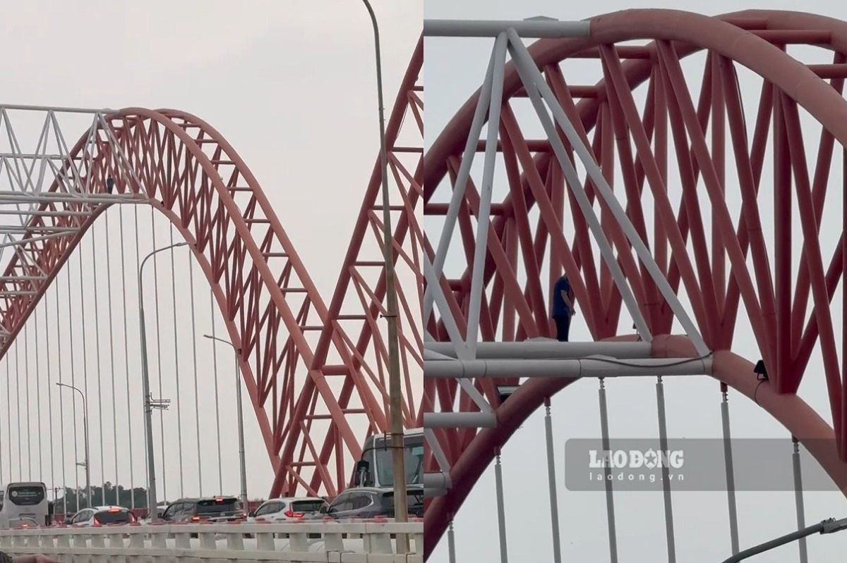 Image of a person suspected of being high on drugs climbing onto the Cỏ May bridge arch on the afternoon of September 17. Photo: Thành An