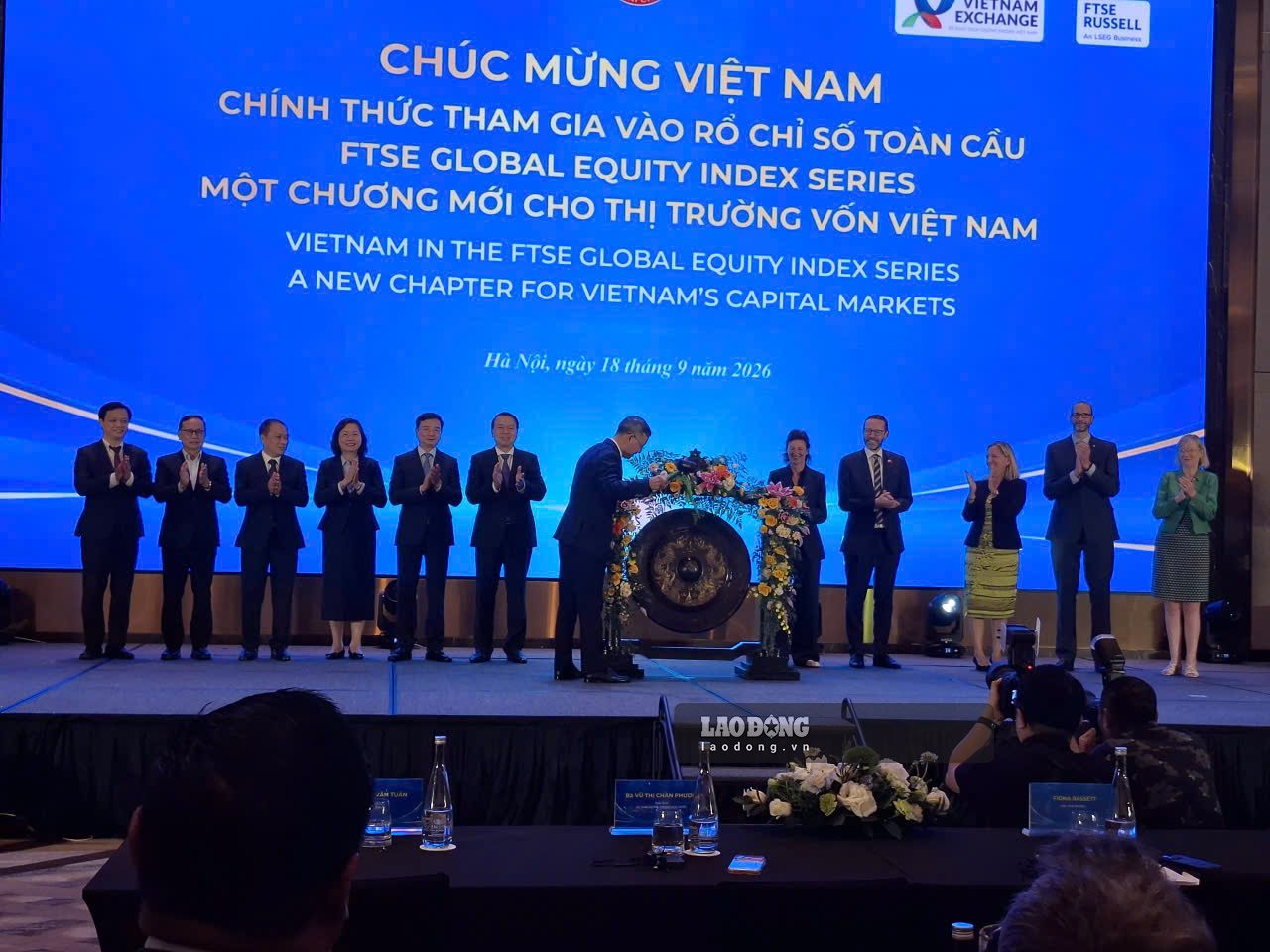 The gong playing ritual, marking Vietnam's promotion to the secondary emerging market. Photo: Luc Giang