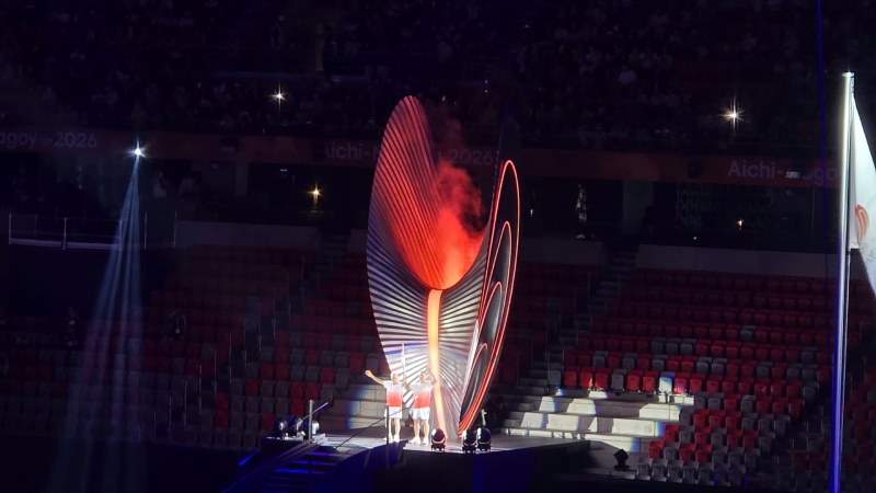 Father and son former athletes Shigenobu and Koji Morufushi light the ASIAD 20 torch. Photo: Quoc Viet