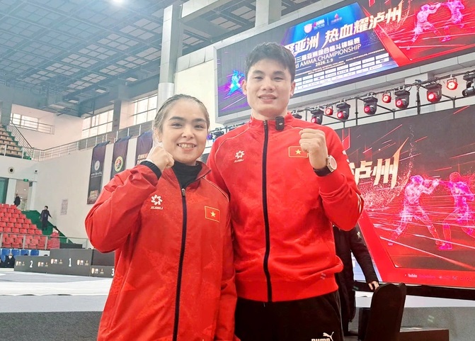 MMA fighter Lo Thi Phung (left) won a gold medal at the 2026 Asian Championships earlier this year and is now actively competing at ASIAD 20. Photo: VMMAF