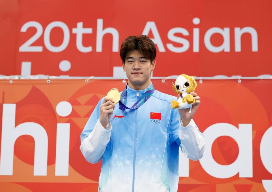 Chinese swimmer Pan Zhanle wins ASIAD gold medal in men's 100m freestyle. Photo: Xinhua