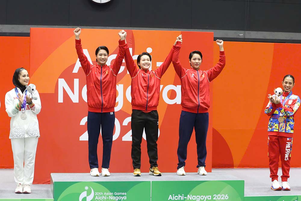 Three Vietnamese female karate athletes on the medal podium at ASIAD 20. Photo: TTVN Delegation