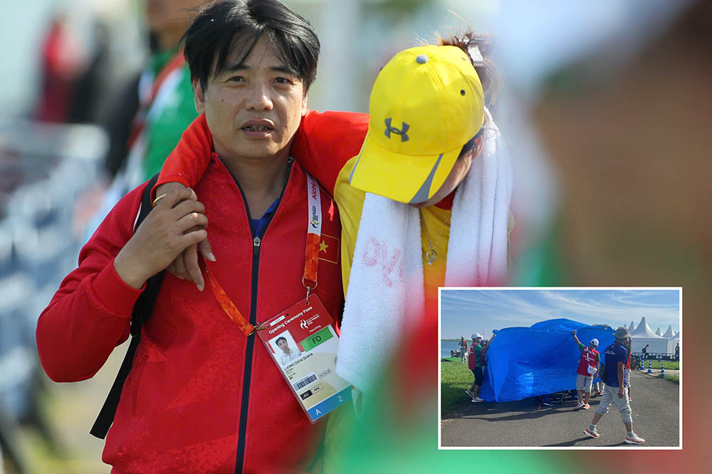Pham Thi Bich Ngoc recibe el apoyo de los médicos para recibir atención después de ganar la medalla de bronce en los ASIAD. Foto: Delegación TTVN