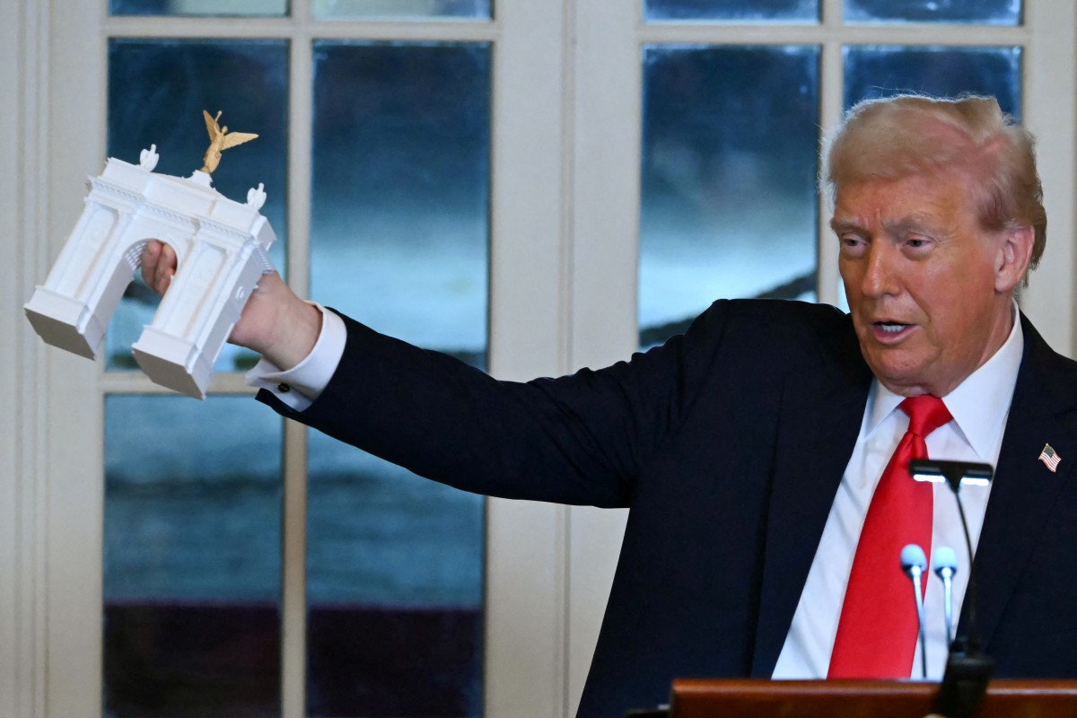 US President Donald Trump and the preliminary model for the triumvirate. Photo: AFP