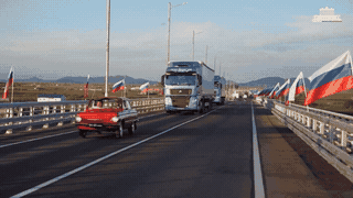 Vehicles circulate on the first road bridge across the Russia-North Korea border. Photo: AFP