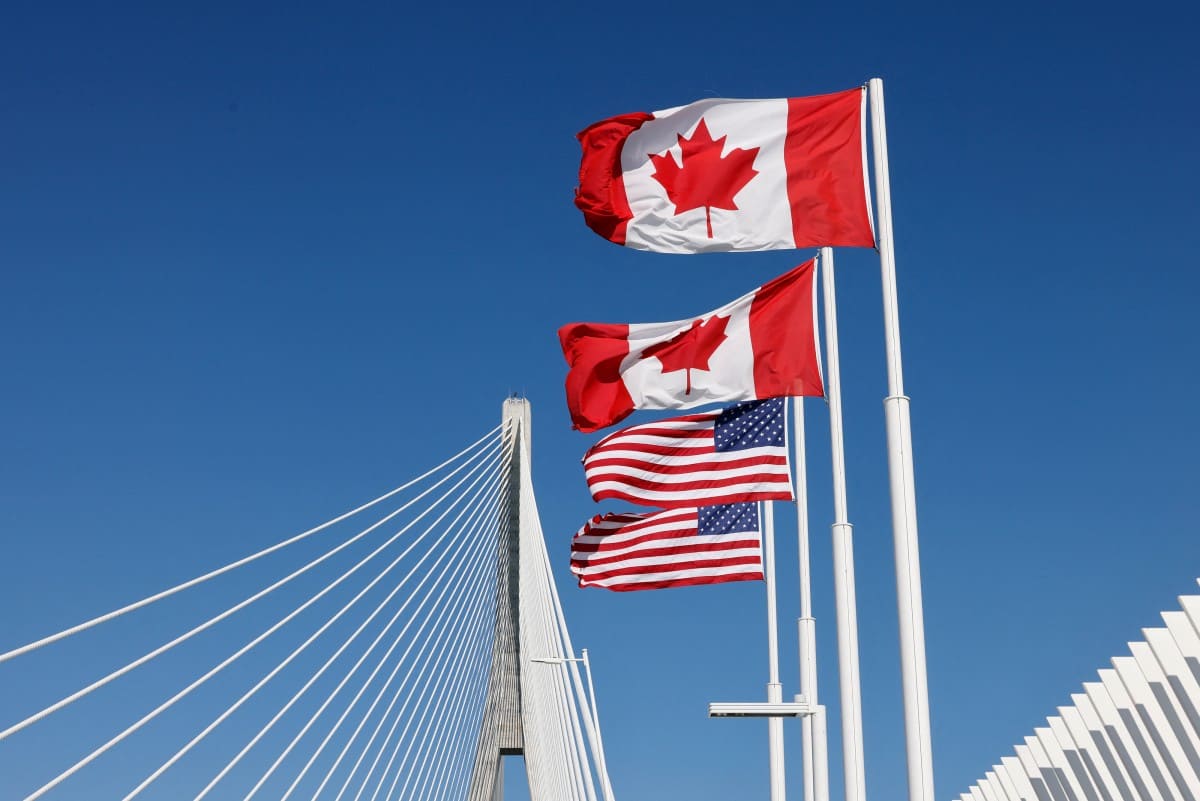 Canadian and US flags on the Gordie Howe Bridge connecting Windsor City (Ontario, Canada) and Detroit City (Michigan, USA) on September 6, 2026. Photo: AFP