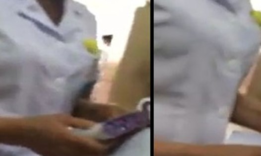 Nữ bác sĩ nhận xấp phong bì của bệnh nhân trong đoạn clip