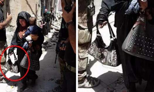Kẻ đánh bom liều chết bế theo một đứa bé đi theo khi kích nổ bom. Ảnh: Al-Mawsleya.