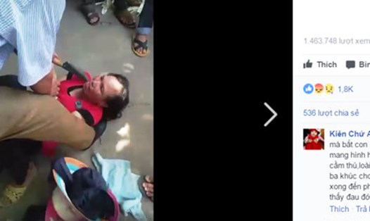 Người phụ nữ bị dí dao vào cổ vì nghi bắt cóc trẻ em (ảnh cắt từ clip)